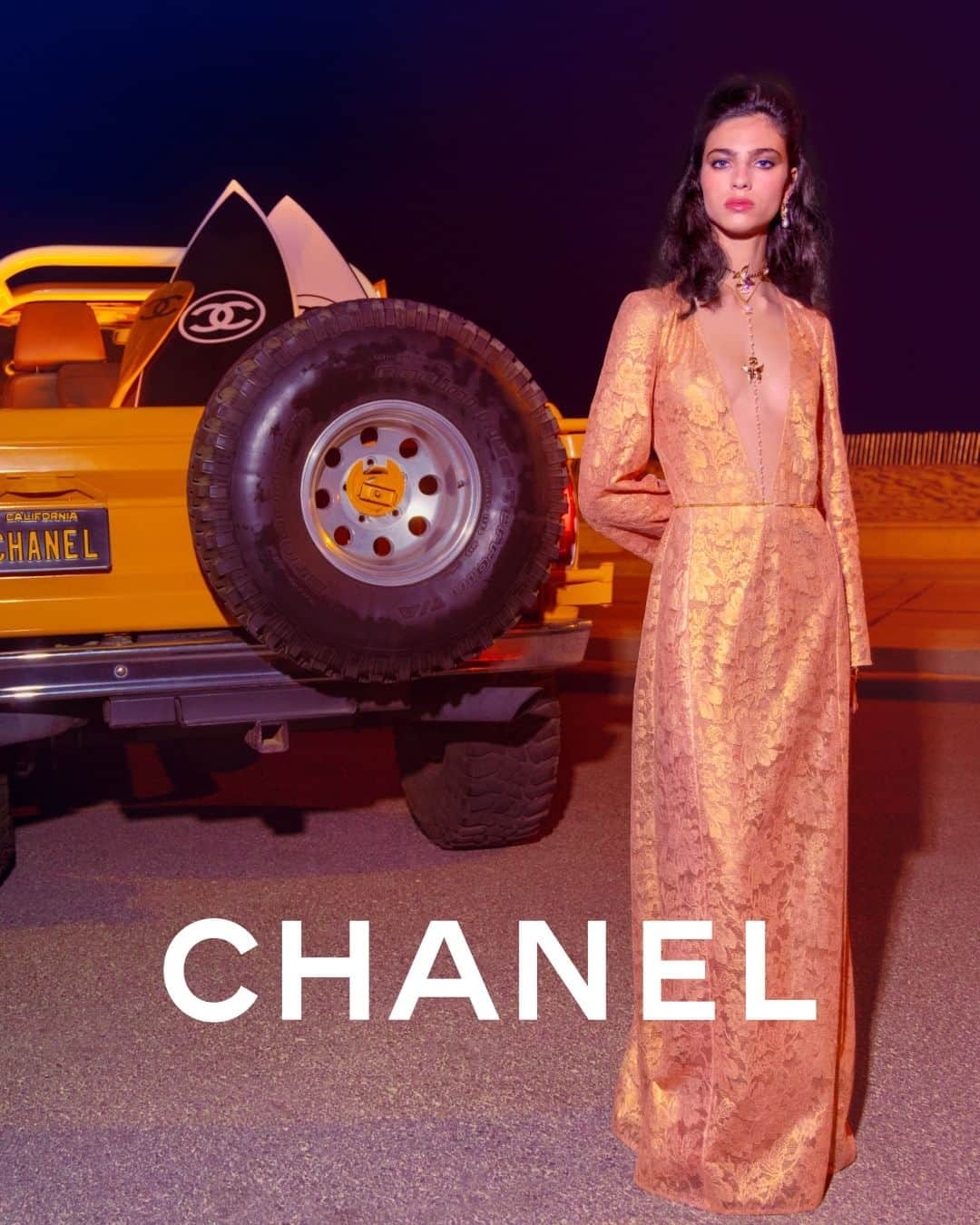 シャネルのインスタグラム：「Model Loli-Bahia embodies the cinematic allure of the CHANEL Cruise 2023/24 collection in a full-length sheer evening dress reminiscent of Hollywood’s Golden Age glamour.  Photographed by Inez & Vinoodh.  The collection is now available in boutiques.  See more at chanel.com  #CHANELCruise @InezandVinoodh @LoliBahiaa」