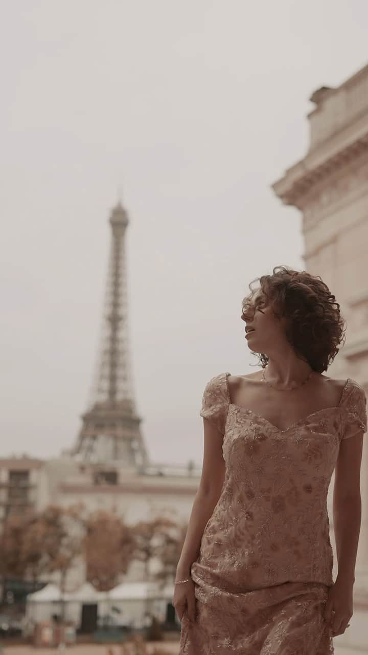 タダシショージのインスタグラム：「May the indefinable charm of Paris forever radiate love, beauty, and sensory delight.  Model @g.faradzhian Videographer @tetris.production   #operasinger #parisstyle #parisstreets #eiffeltowerparis」