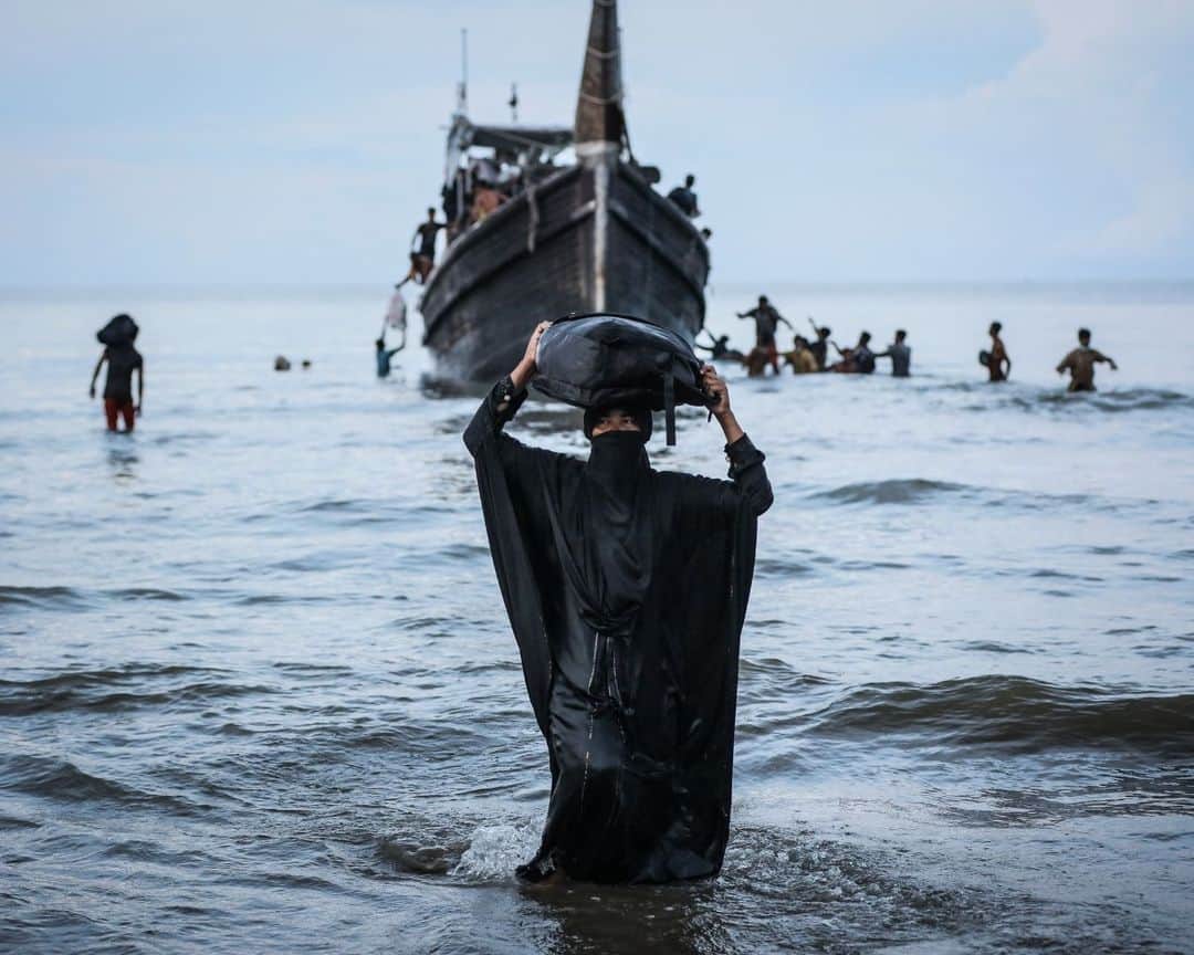 AFP通信さんのインスタグラム写真 - (AFP通信Instagram)「Boat with hundreds of Rohingya refugees spotted off Indonesia⁣ ⁣ 1- A Newly arrived Rohingya refugee walks to the beach after the local community decided to temporarily allow them to land for water and food in Ulee Madon, Aceh province on November 2023.⁣ ⁣ 2 - Newly arrived Rohingya refugees rest on the beach in Ulee Madon, Aceh province on November 2023.⁣ ⁣ 3 - Newly arrived Rohingya refugees return to a boat after the local community decided to temporarily allow them to land for water and food in Ulee Madon, Aceh province, on November 2023.⁣ ⁣ 4 - A local youth looks at a boat carrying newly arrived Rohingya refugees stranded after the nearby community decided not to allow them to land after giving them water and food in Pineung, Aceh province on November 2023.⁣ ⁣ 5 - Three Rohingya refugees try to swim to the beach as they are stranded on a boat in Pineung, Aceh province on November 2023.⁣ ⁣ 6 - Rohingya refugees react after reaching the beach by swimming as others are stranded on a boat in Pineung, Aceh province on November 2023.⁣ ⁣ 7 - A newly arrived Rohingya refugee lies on the sand after reaching the beach by swimming in Pineung, Aceh province on November 2023.⁣ ⁣ 8->9 - Newly arrived Rohingya refugees are stranded on a boat as the nearby community decided not to allow them to land after providing water and food in Pineung, Aceh province on November 2023.⁣ ⁣ 10 - A local fisherman's boat tows the boat of newly arrived Rohingya refugees to the offshore after the nearby community gave them water and food but did not allow them to land on the beach in Pineung, Aceh province on November 2023.⁣ 📷 @amandajufrian ⁣ #AFPPhoto」11月17日 20時05分 - afpphoto
