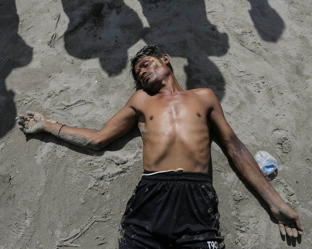 AFP通信さんのインスタグラム写真 - (AFP通信Instagram)「Boat with hundreds of Rohingya refugees spotted off Indonesia⁣ ⁣ 1- A Newly arrived Rohingya refugee walks to the beach after the local community decided to temporarily allow them to land for water and food in Ulee Madon, Aceh province on November 2023.⁣ ⁣ 2 - Newly arrived Rohingya refugees rest on the beach in Ulee Madon, Aceh province on November 2023.⁣ ⁣ 3 - Newly arrived Rohingya refugees return to a boat after the local community decided to temporarily allow them to land for water and food in Ulee Madon, Aceh province, on November 2023.⁣ ⁣ 4 - A local youth looks at a boat carrying newly arrived Rohingya refugees stranded after the nearby community decided not to allow them to land after giving them water and food in Pineung, Aceh province on November 2023.⁣ ⁣ 5 - Three Rohingya refugees try to swim to the beach as they are stranded on a boat in Pineung, Aceh province on November 2023.⁣ ⁣ 6 - Rohingya refugees react after reaching the beach by swimming as others are stranded on a boat in Pineung, Aceh province on November 2023.⁣ ⁣ 7 - A newly arrived Rohingya refugee lies on the sand after reaching the beach by swimming in Pineung, Aceh province on November 2023.⁣ ⁣ 8->9 - Newly arrived Rohingya refugees are stranded on a boat as the nearby community decided not to allow them to land after providing water and food in Pineung, Aceh province on November 2023.⁣ ⁣ 10 - A local fisherman's boat tows the boat of newly arrived Rohingya refugees to the offshore after the nearby community gave them water and food but did not allow them to land on the beach in Pineung, Aceh province on November 2023.⁣ 📷 @amandajufrian ⁣ #AFPPhoto」11月17日 20時05分 - afpphoto