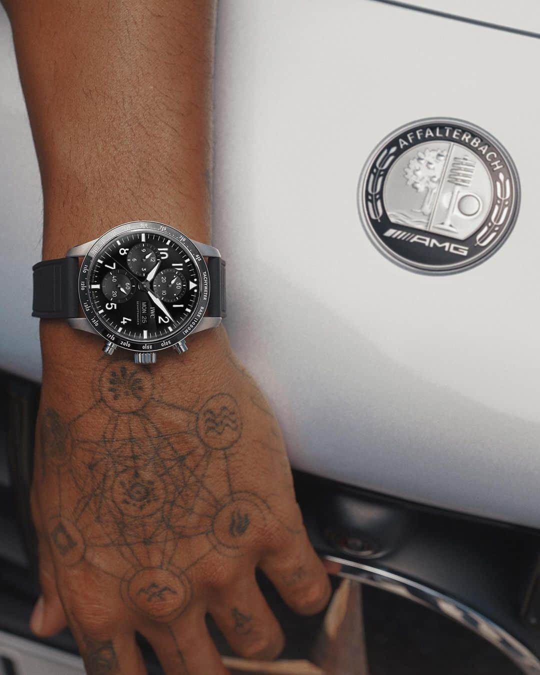 IWCのインスタグラム：「When precision, passion, and partnership converge.  The new Pilot's Watch Performance Chronograph 41 AMG on the wrist of @lewishamilton.  🔗 Link In Bio  #PerformanceChronograph I #AMGxIWC I #TheReference」