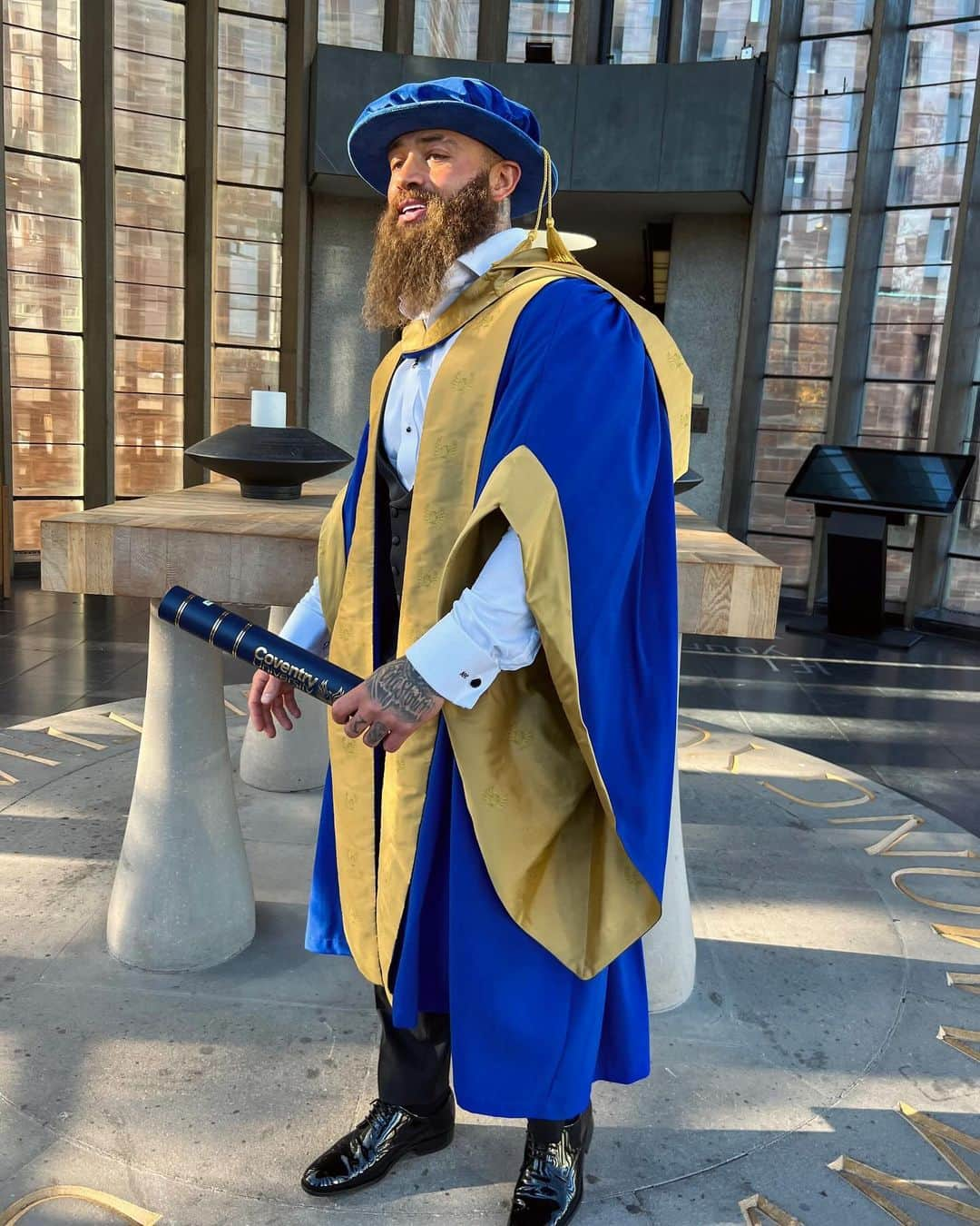 アシュリー・ケインのインスタグラム：「Today I proudly attended an incredible graduation ceremony at Coventry Cathedral where I received my honorary Doctorate of Letters and PhD from @covuni in recognition  for my contributions to society and childhood cancer 👨🏽‍🎓📜   I accept this well respected award in honour of my beautiful daughter Azaylia Diamond Cain, who is the sole inspiration behind my relentless ambition to making a difference.. I also humbly and gratuitously accept this award on behalf of my amazing family and the incredible community who selflessly love, support and fuel this powerful and passionate fight in making vital and impactful change with @theazayliafoundation for children fighting cancer 🦁🧡  I thank you, I thank you all 🙏🏾  Sincerely, Dr Cain 🫡」