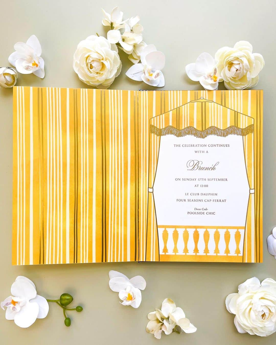 Ceci Johnsonさんのインスタグラム写真 - (Ceci JohnsonInstagram)「WEDDING | S&A’s celebration concluded with a delightful poolside brunch. Drawing inspiration from the charming yellow and white stripe parasols showcased on page 3 of the book invitation, we enhanced the design using gold foil stripes. To complement the theme, we crafted matching signage and napkins featuring an embroidered monogram in vibrant yellow designed by our team. #CeciCouture ⠀⠀⠀⠀⠀⠀⠀⠀⠀ CREATIVE PARTNERS: Luxury Invitation & Event Branding: @cecinewyork Planning & Design: @lavenderandroseweddings Venue & Catering:  @fscapferrat Photography: @daniloandsharon Videography: @chromata_films_weddings Production: @deco_flamme Tableware: @maisonmargauxltd @maison_options Floral Design: @roni_floral_design Music: @troubadoursriviera @rozgajelenaofficial Entertainment: @prodiammclescure ⠀⠀⠀⠀⠀⠀⠀⠀⠀ #cecinewyork #ceciwedding #luxuryinvitations #elegantdesigns #coutureinvites #opulentdetails #bespokeinvitations #ccelebrations #artistryinvitations #highenddesigns #luxurystationery #premiuminvitations #exquisitedetails #invitationelegance #celebrateinstyle #glamorousinvites #luxurycelebrations #finestationery #customizedelegance #celebrationperfection #invitationcouture #elevateyourevent #luxuryeventplanning」11月17日 23時31分 - cecinewyork