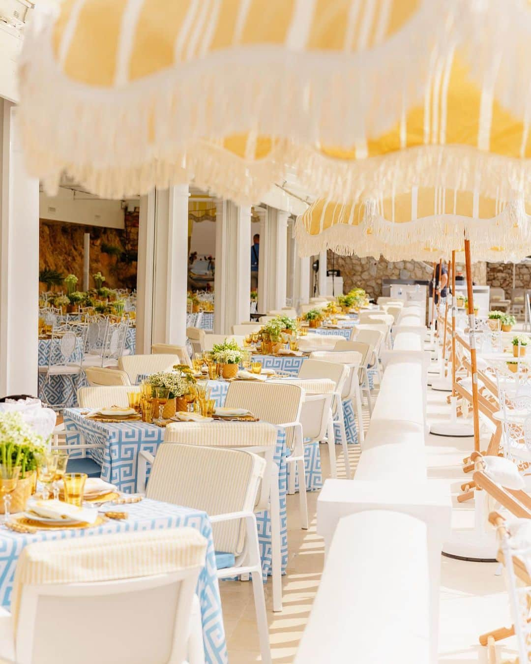 Ceci Johnsonさんのインスタグラム写真 - (Ceci JohnsonInstagram)「WEDDING | S&A’s celebration concluded with a delightful poolside brunch. Drawing inspiration from the charming yellow and white stripe parasols showcased on page 3 of the book invitation, we enhanced the design using gold foil stripes. To complement the theme, we crafted matching signage and napkins featuring an embroidered monogram in vibrant yellow designed by our team. #CeciCouture ⠀⠀⠀⠀⠀⠀⠀⠀⠀ CREATIVE PARTNERS: Luxury Invitation & Event Branding: @cecinewyork Planning & Design: @lavenderandroseweddings Venue & Catering:  @fscapferrat Photography: @daniloandsharon Videography: @chromata_films_weddings Production: @deco_flamme Tableware: @maisonmargauxltd @maison_options Floral Design: @roni_floral_design Music: @troubadoursriviera @rozgajelenaofficial Entertainment: @prodiammclescure ⠀⠀⠀⠀⠀⠀⠀⠀⠀ #cecinewyork #ceciwedding #luxuryinvitations #elegantdesigns #coutureinvites #opulentdetails #bespokeinvitations #ccelebrations #artistryinvitations #highenddesigns #luxurystationery #premiuminvitations #exquisitedetails #invitationelegance #celebrateinstyle #glamorousinvites #luxurycelebrations #finestationery #customizedelegance #celebrationperfection #invitationcouture #elevateyourevent #luxuryeventplanning」11月17日 23時31分 - cecinewyork