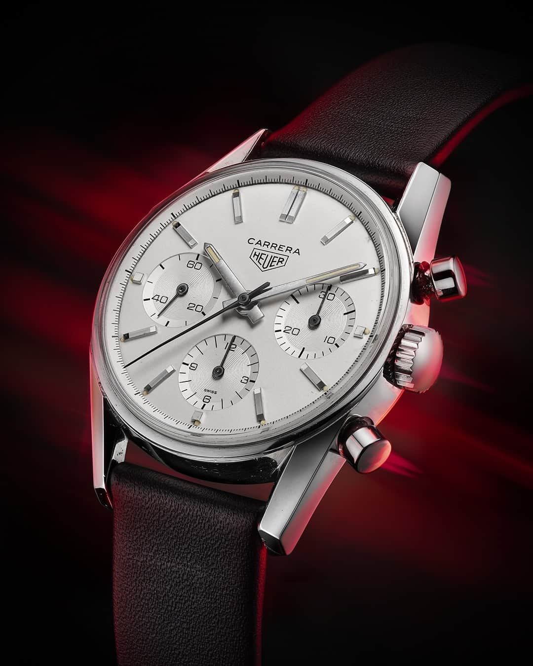 タグ・ホイヤーのインスタグラム：「Honoring Jack Heuer's greatest achievement: the Carrera collection ⁣ ⁣ Our honorary chairman’s passion for modernist design sparked the conception of the Carrera collection in 1963, with the first model reference 2447. From its clean dial, the collection evolved with the iconic 18-carat gold reference 1158 CHN, symbolizing victory on the racetrack. In 1996, the Carrera resurged with the minimalist design of reference CS3110 as an ode to its early models. Now, celebrating its 60th anniversary, the TAG Heuer Carrera Chronograph represents a culminating point in the story of this iconic collection. Featuring a sleek curved sapphire crystal, known as "glassbox", the latest model honors its heritage while paving the way for the future.⁣ ⁣ #TAGHeuerCarrera #TAGHeuer」