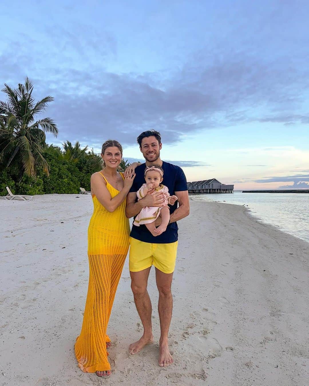Ashley Jamesのインスタグラム：「So happy to be here in the Maldives as a family! 💕🌴 It’s like heaven here and it’s so nice to be able to switch off and spend time together.   I’m so tired because of the time difference, so I’ll give a proper update tomorrow but the kids have both adapted so well!   We’re staying at a resort called Kuramathi where it feels like living in a post card. The resort has an amazing kids club, some of the best diving in the Maldives, and those famous sunsets. 🦈 🌅 What’s so nice is it’s only a boat trip away from the main airport.  Alf didn’t want to be in these photos, but swipe to the end to see how happy he is. Ada has been a dream. She’s really come out of her shell and I can’t cope with her little holiday wardrobe. I actually bought this dress for @jasminebarcelona daughter, and I can’t believe ada is in it already!   I’m falling asleep so I’ll update properly tomorrow. But I’m so happy. 💓  Love you all! X  @kuramathiisland xx  AD - we very amazingly given a slight Press discount and we're paying for all activities including diving and kids club and upgraded to the all inclusive . ❤️🫶」