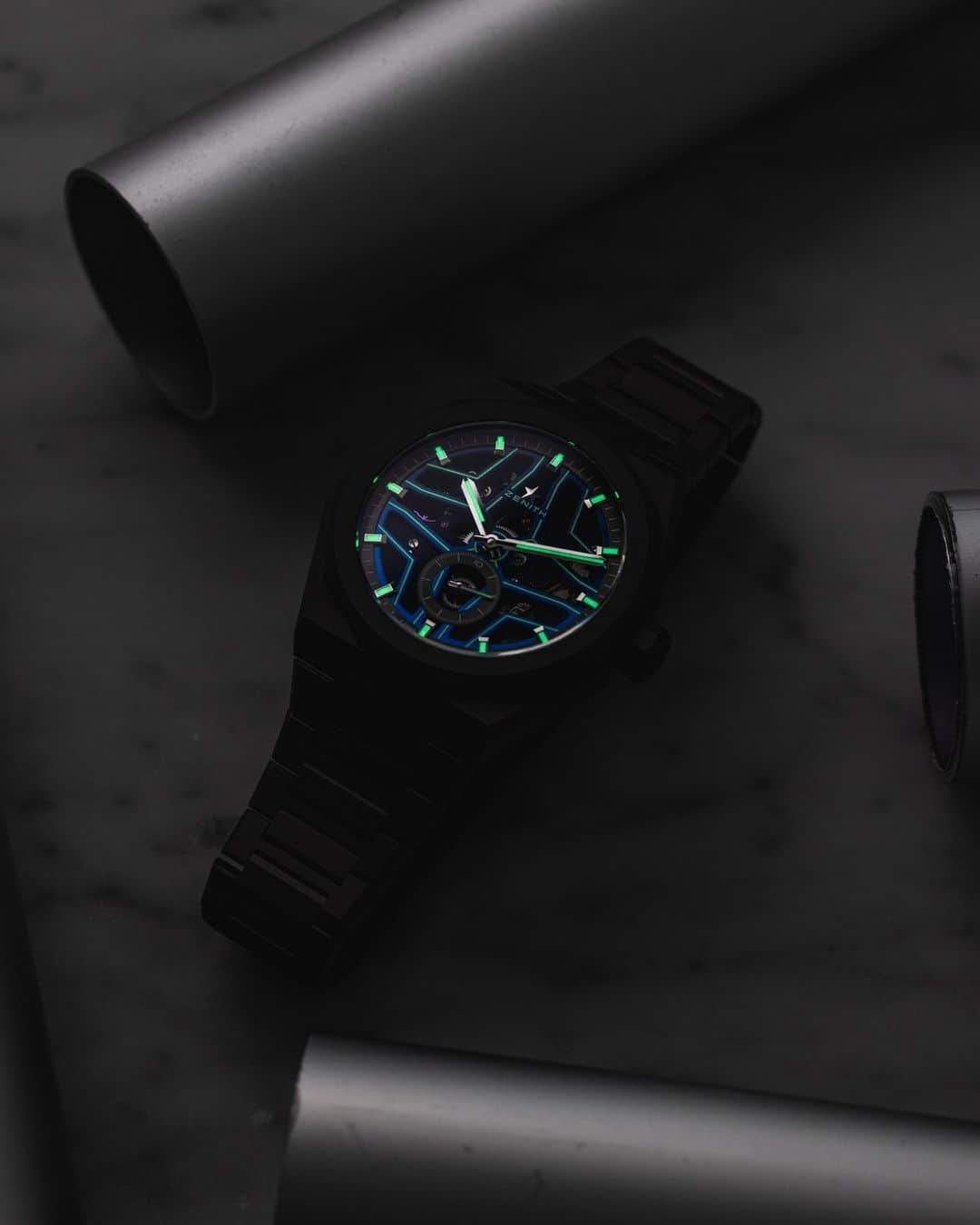 ゼニスのインスタグラム：「The brightest star on the horizon.⭐ The #DefySkylineSkeleton Night Surfer El Primero, in collaboration with @timetidewatches, features an open star-shaped dial that is highlighted with luminescent lines that come to life in the dark, making the star motif that much more visible and brighter.✨」