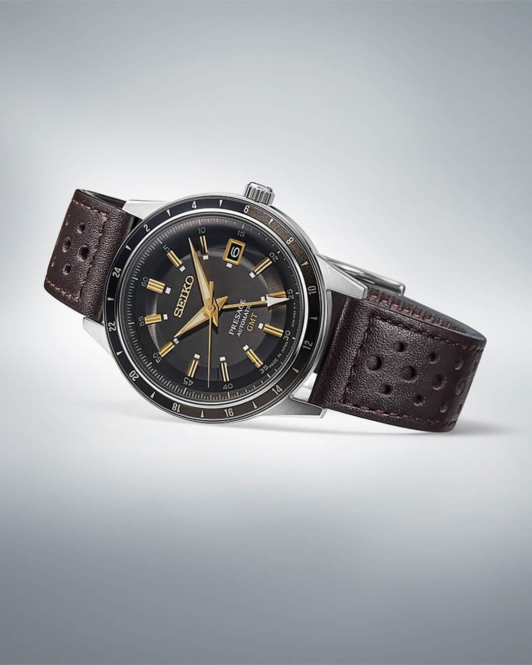 Seiko Watchesのインスタグラム：「Regal & Retro! ⚜️ - Celebrating the spirit of the decade, the Presage '60s GMT collection incorporates dial elements from Seiko’s 1964 “Crown Chronograph,” Japan’s first watch with a stopwatch function. Beautifully framed by a black and dark gray 24-hour GMT bezel, the dark brown-gray dial features gold accents and pulls together a finished and classic look.   #SSK013 #Seiko #Presage」